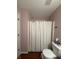 Bathroom with fresh paint, white shower curtain, and a toilet at 13993 Whittier Dr, Fishers, IN 46038