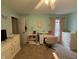 Bright bedroom offers a desk, fresh paint, carpeted floors, and a large window at 13993 Whittier Dr, Fishers, IN 46038