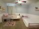 Cozy bedroom featuring two beds with neutral bedding, soft carpet, and ceiling fan at 13993 Whittier Dr, Fishers, IN 46038