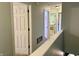 Open hallway view with several doors and access to rooms with neutral wall colors at 13993 Whittier Dr, Fishers, IN 46038
