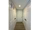 Hallway with double doors on both sides and wood flooring at 13993 Whittier Dr, Fishers, IN 46038