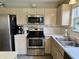 Bright kitchen featuring stainless steel appliances and ample counter space at 13993 Whittier Dr, Fishers, IN 46038