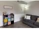 Cozy living room featuring gray sofa, hardwood floors, and cube storage unit at 13993 Whittier Dr, Fishers, IN 46038