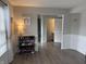 Inviting living room with hardwood floors, a shoe rack, and a view into the bathroom at 13993 Whittier Dr, Fishers, IN 46038