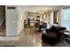 Open floor plan featuring light wood floors seamlessly connecting living, dining, and kitchen at 13993 Whittier Dr, Fishers, IN 46038