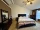 Spacious main bedroom with large bed, dresser with mirror, and neutral carpet at 13993 Whittier Dr, Fishers, IN 46038