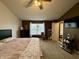 Cozy bedroom featuring a comfortable bed, dark furniture and a window with natural light at 13993 Whittier Dr, Fishers, IN 46038