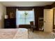Bright primary bedroom with dresser, décor, mirror and a window that lets in plenty of natural light at 13993 Whittier Dr, Fishers, IN 46038