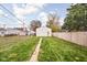 Expansive backyard with a pathway leading to a detached garage, offering ample green space at 1429 Linden St, Indianapolis, IN 46203