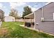 Spacious backyard with a covered patio area and a detached garage, perfect for outdoor entertaining at 1429 Linden St, Indianapolis, IN 46203
