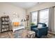 Cozy Bedroom with a white crib, plush armchair, and colorful accents creating a warm atmosphere at 1429 Linden St, Indianapolis, IN 46203