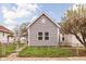 Charming gray home featuring a well-maintained lawn and a classic, inviting facade at 1429 Linden St, Indianapolis, IN 46203