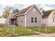 Charming single-Gathering home with gray siding, well-maintained lawn, and welcoming curb appeal at 1429 Linden St, Indianapolis, IN 46203