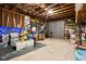 Spacious garage with exposed beams and ample storage space, perfect for hobbies or projects at 1429 Linden St, Indianapolis, IN 46203