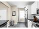 Galley kitchen features stainless steel appliances, neutral walls and floors and natural light at 1429 Linden St, Indianapolis, IN 46203