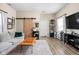 Bright living room featuring modern furnishings, a statement rug, and a sliding barn door at 1429 Linden St, Indianapolis, IN 46203