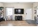 Open living space with modern decor, a large TV, and plenty of room for entertaining at 1429 Linden St, Indianapolis, IN 46203