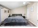 Comfortable main bedroom features a large bed, neutral walls, and minimalist decor for a relaxing space at 1429 Linden St, Indianapolis, IN 46203