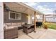 Outdoor patio area featuring comfortable wicker furniture and a grill, great for gatherings at 1429 Linden St, Indianapolis, IN 46203