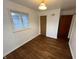 Bright bedroom with hardwood floors, a window, and neutral walls at 1509 N Mann Ave, Muncie, IN 47304