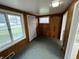 Entrance area with paneled walls, windows and tiled floor at 1509 N Mann Ave, Muncie, IN 47304