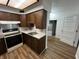 Classic kitchen with wood cabinets, practical countertops, and modern appliances at 1509 N Mann Ave, Muncie, IN 47304