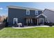 A backyard patio with a pergola, outdoor seating, and well-maintained lawn for outdoor gatherings at 15493 Kennewick, Noblesville, IN 46062