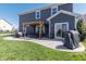A backyard patio with a pergola, outdoor seating, and well-maintained lawn for outdoor gatherings at 15493 Kennewick, Noblesville, IN 46062