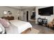 Bedroom featuring a TV, shelving unit, closet, and a comfortable bed with decorative pillows at 15493 Kennewick, Noblesville, IN 46062