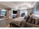 Relaxing bedroom with vaulted ceiling, TV, a large mirror, and a comfortable bed with decorative pillows at 15493 Kennewick, Noblesville, IN 46062