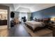 Open bedroom featuring a home office, TV, and a comfortable bed with decorative pillows at 15493 Kennewick, Noblesville, IN 46062