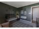 Stylish Bedroom with modern decor, a crib, and a cozy reading nook, creating a warm and inviting space at 15493 Kennewick, Noblesville, IN 46062