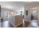 Second floor hallway featuring hardwood floors, natural light, and a view of the laundry room at 15493 Kennewick, Noblesville, IN 46062