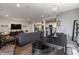 Inviting open-concept living room and dining area with modern furnishings and hardwood floors, offering a seamless flow at 15493 Kennewick, Noblesville, IN 46062