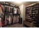 Organized walk-in closet with custom shelves, hanging racks, and a shoe rack for storage at 15493 Kennewick, Noblesville, IN 46062