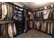 Spacious walk-in closet with custom shelving, hanging racks, and ample storage space for organization at 15493 Kennewick, Noblesville, IN 46062