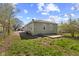 Large backyard with a concrete patio and mature trees at 1836 N Riley Ave, Indianapolis, IN 46218