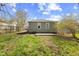 Spacious backyard featuring a lush lawn and a concrete patio at 1836 N Riley Ave, Indianapolis, IN 46218