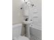 Compact bathroom features classic black and white tile floor with a pedestal sink at 1836 N Riley Ave, Indianapolis, IN 46218