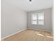 Sunlit bedroom showcasing light wood flooring and bright light at 1836 N Riley Ave, Indianapolis, IN 46218