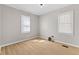 A bright bedroom with ample natural light from two windows and light wood floors at 1836 N Riley Ave, Indianapolis, IN 46218