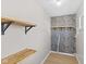 Walk-in closet with wood shelving and designer wallpaper at 1836 N Riley Ave, Indianapolis, IN 46218