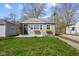 Charming single-story home with light green siding, a well-maintained lawn, and a cozy, inviting curb appeal at 1836 N Riley Ave, Indianapolis, IN 46218