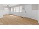 The living room features lots of natural light, fresh paint, and light-colored wood flooring at 1836 N Riley Ave, Indianapolis, IN 46218