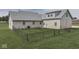 Aerial view of a brick house with a fenced backyard and green grass at 1873 S 510 E, Franklin, IN 46131