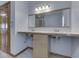 Bright bathroom with double sink vanity, wood trim and cabinets, and a large mirror at 1873 S 510 E, Franklin, IN 46131