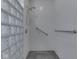 Accessible shower stall with sleek tile, glass block wall and supportive grab bars at 1873 S 510 E, Franklin, IN 46131