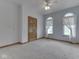 Carpeted bedroom with arched windows and soft, sheer draperies for an airy and bright feel at 1873 S 510 E, Franklin, IN 46131