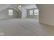 Expansive bonus room with a ceiling fan and natural light from multiple windows at 1873 S 510 E, Franklin, IN 46131