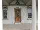 Close-up of front door with decorative glass, flanked by elegant arched windows at 1873 S 510 E, Franklin, IN 46131